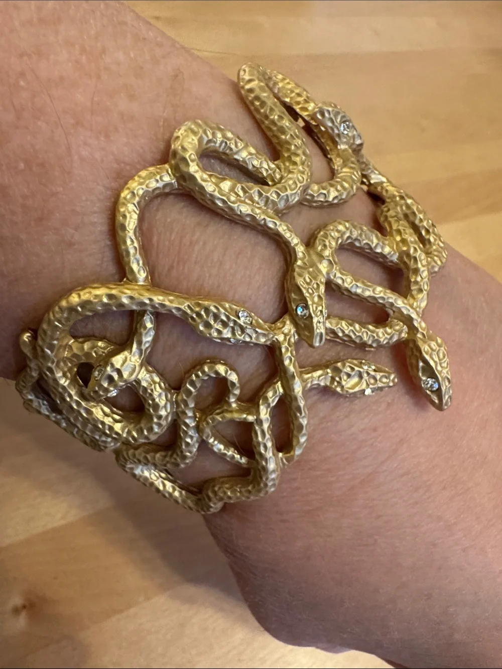 NWT textured gold tone entwined multi-snake clamper bracelet w/white crystal eye